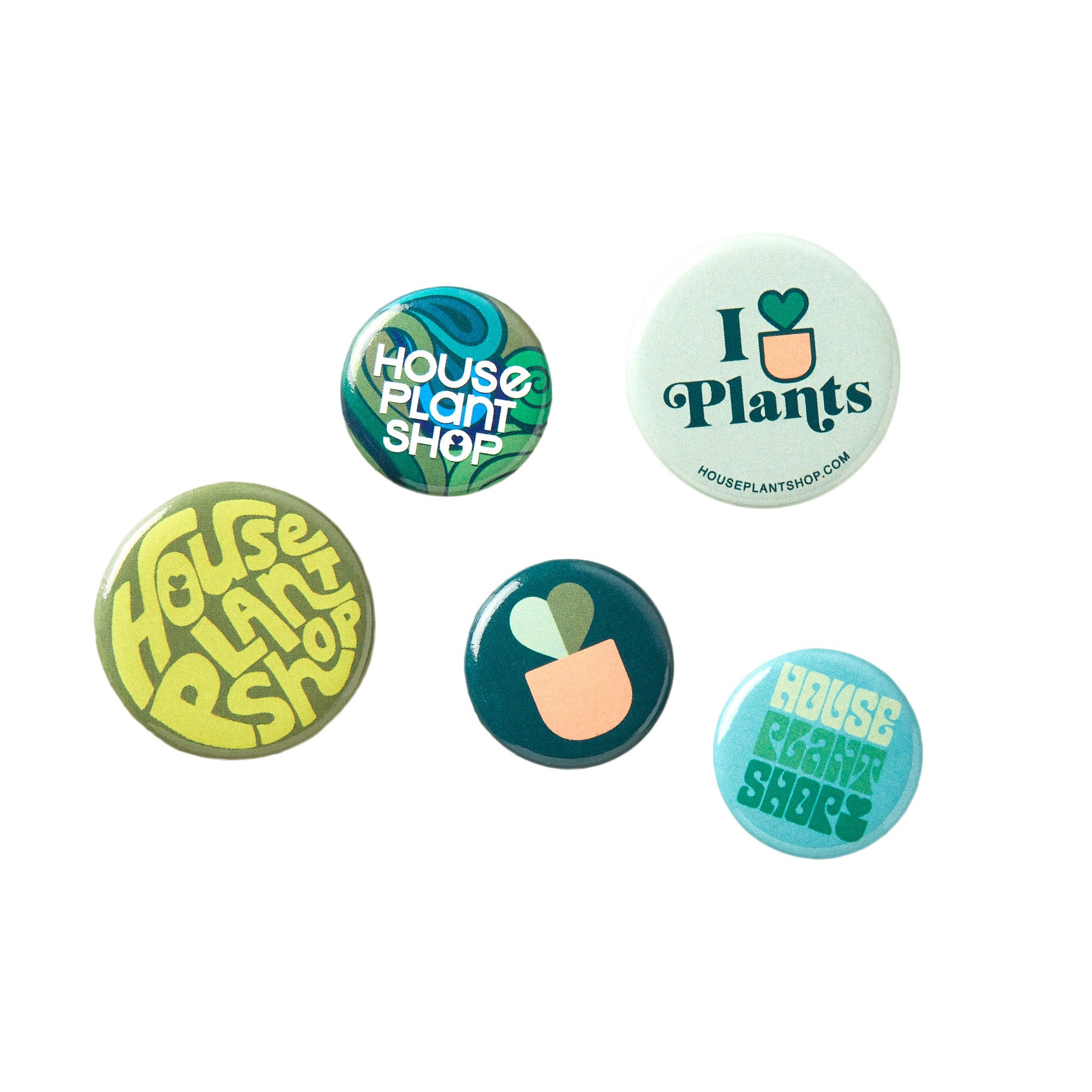 A set of buttons featuring a green plant design from a top garden center near me.